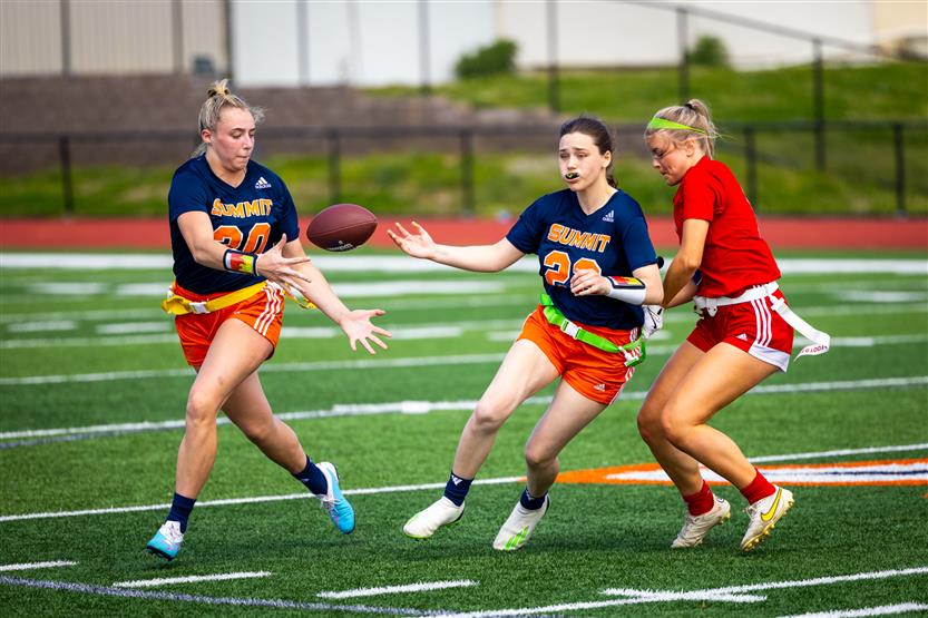 Students play flag football